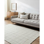 Ishaq Solid and Border Ivory Area Rug