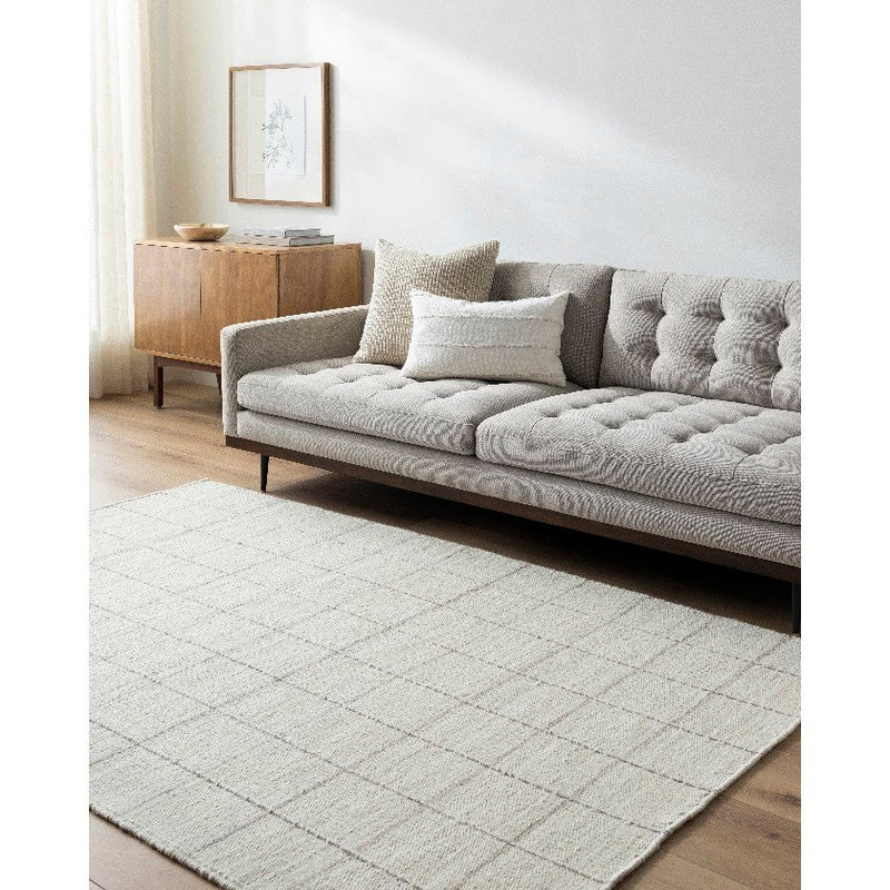 Ishaq Solid and Border Ivory Area Rug
