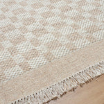 Clinten Solid and Border Tan Area Rug