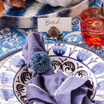 Straw pompom napkin rings, indigo, set of four