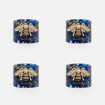 Stripey bee resin napkin rings, blue tortoiseshell, set of four