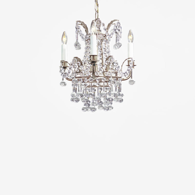 Italian chandelier with antique silver leaf and crystals.