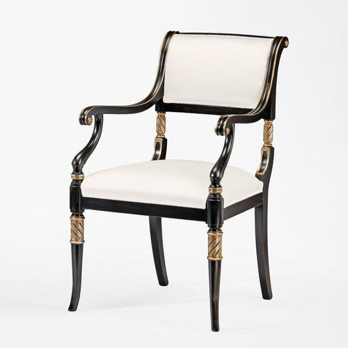 Black armchair with silver accents and cream fabric.