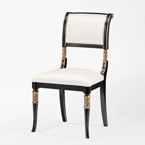 Black wood chair with silver accents and cream fabric.