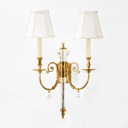Brass and crystal wall sconce.