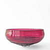 Magenta glass decorative bowl.