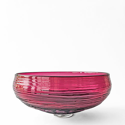 Magenta glass decorative bowl.