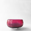 Magenta glass decorative bowl.